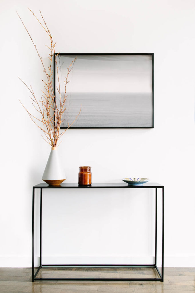 entryway with mirror and table